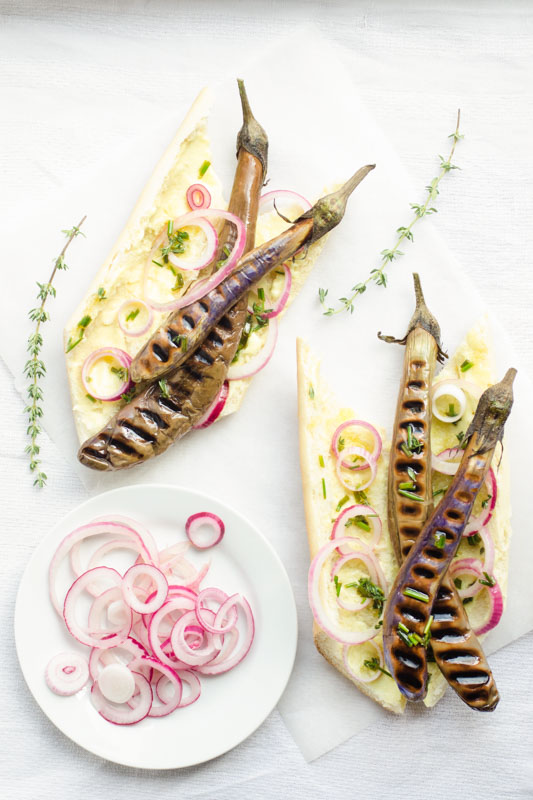 Chinese eggplant hot dogs with mustard mayo, herbed oil and quick pickled onions // vegan