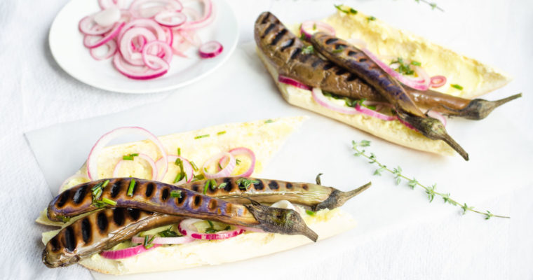 Chinese eggplant hot dogs with mustard mayo, herbed oil and quick pickled onions {vegan}
